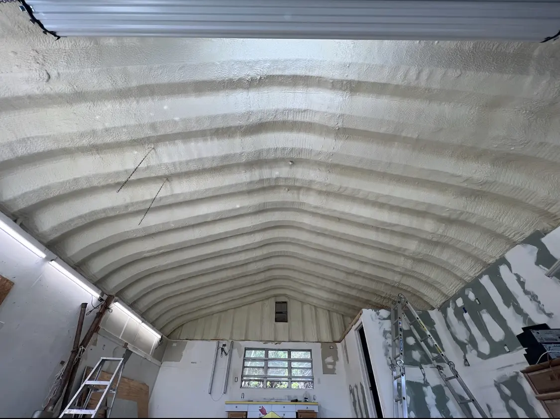Spray polyurethane foam applied to the underside of a metal roof deck in East Honolulu